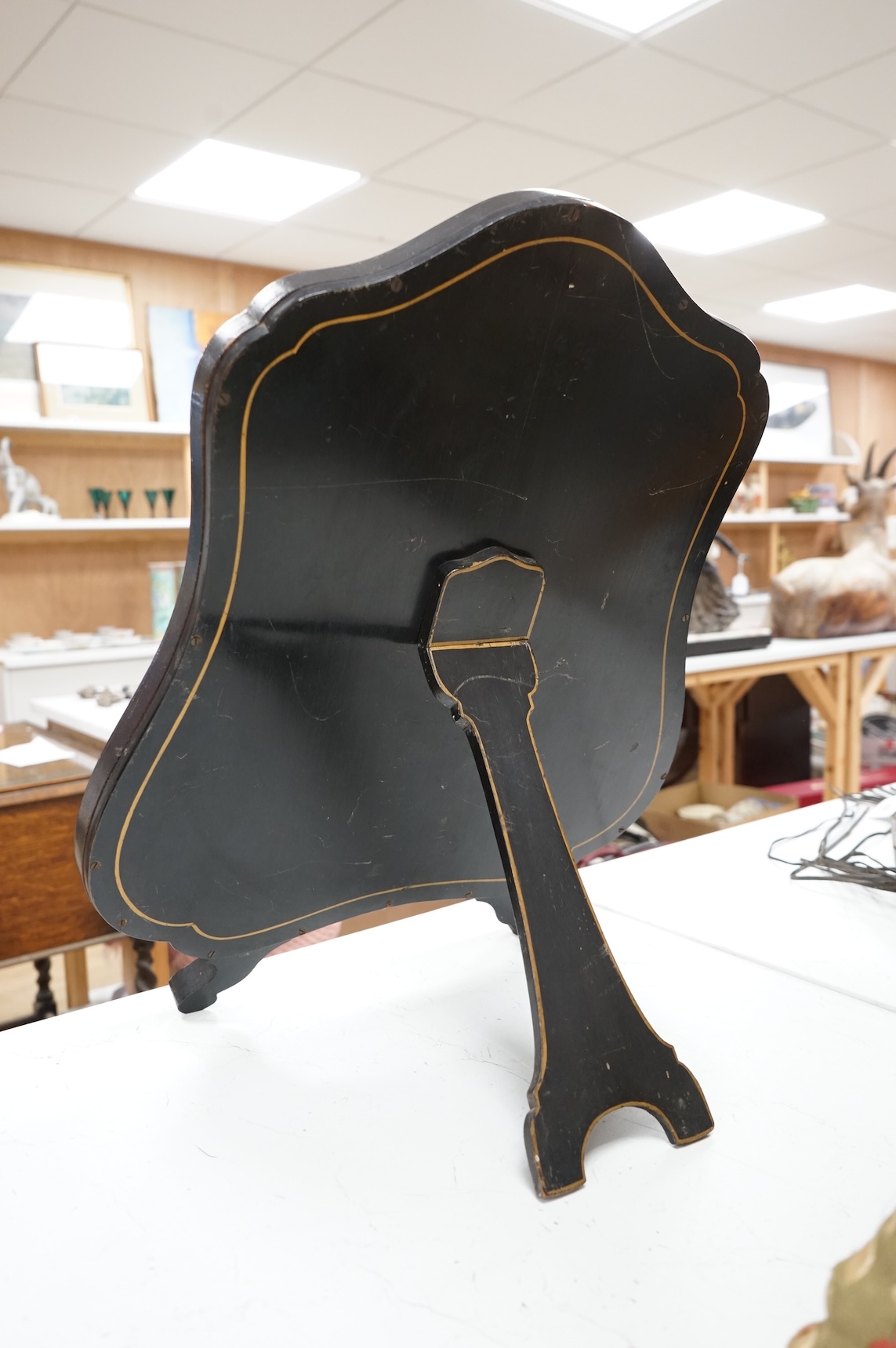 A 1920's Japanned easel mirror, 59cm high